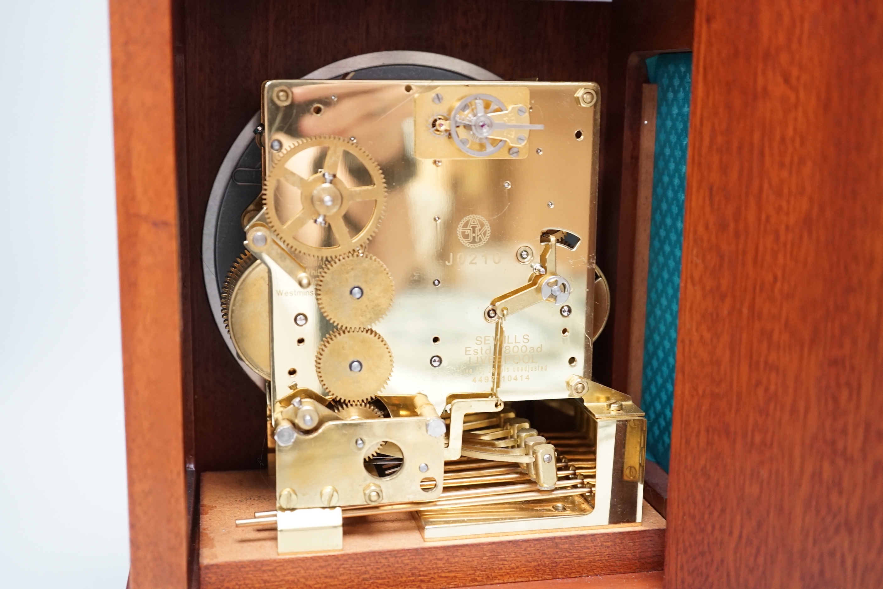 Sewills, Liverpool. An inlaid mantel clock with three train balance escapement movement, chiming on eight gongs, 37cm high